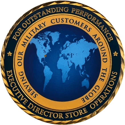 A round, gold-toned challenge coin with a raised, intricate design.