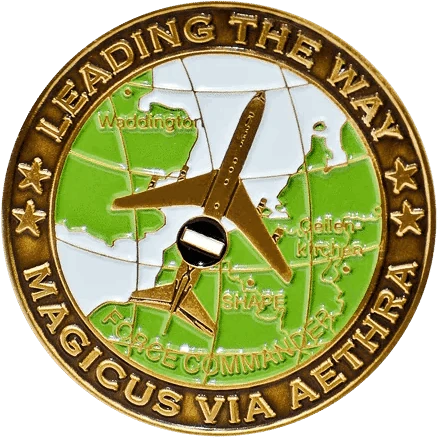 A round, bronze-toned challenge coin with a raised design.