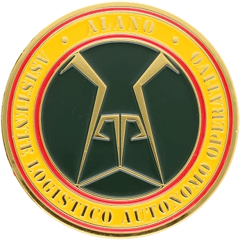 A challenge coin with a gold-colored outer ring and a green inner circle.