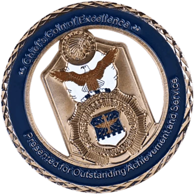 A circular challenge coin with a blue enamel outer ring and a gold-colored inner section.
