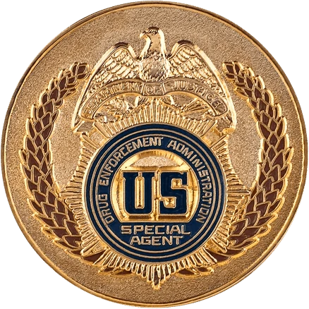 A round, bronze-colored challenge coin.